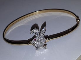 9K BUNNY BANGLE - 5 GRAMS - MISSING A STONE AS SHOWN 