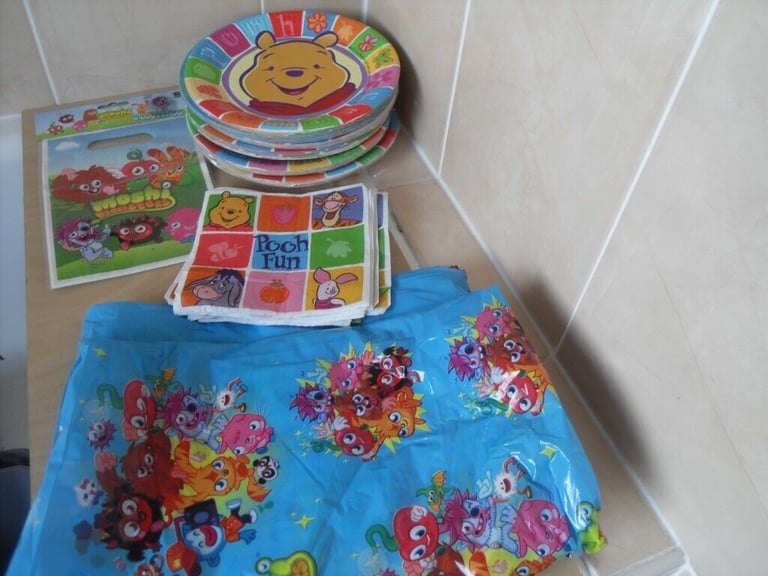 Great bundle of children's plates, tablecloth, etc. £10