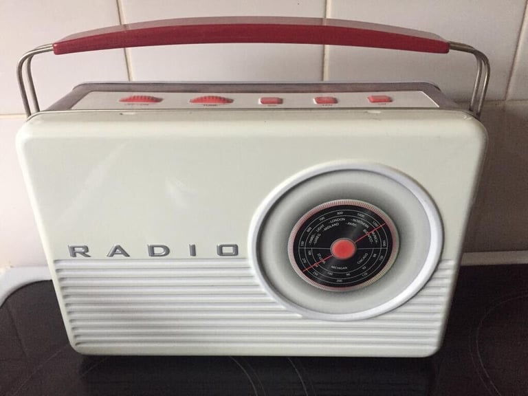 White Vintage novelty radio biscuit tin white with red handle. 