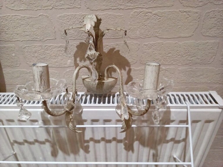 A pair of beautiful twin cream/gold wall lights with crystal droplets 