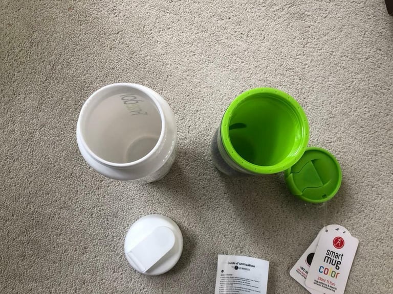 A Smart Travel Mug, White water bottle, Marks & Spencer pouch bag.