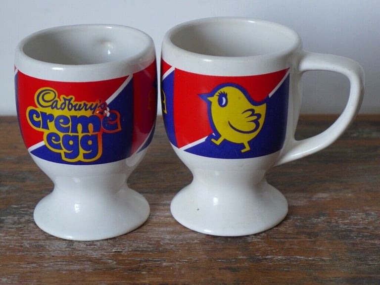 EASTER COLLECTABLES: TWO 1980s VINTAGE CADBURY’S CREME EGG MUGS. £12 for the two.