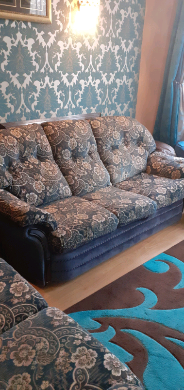 Blue 3 seater velvet sofa with a matching foot stool 