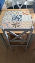 Tile topped tables and 2 chairs.