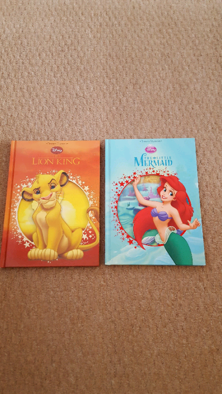 Two large hard backed Disney books