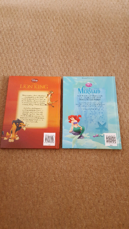 Two large hard backed Disney books