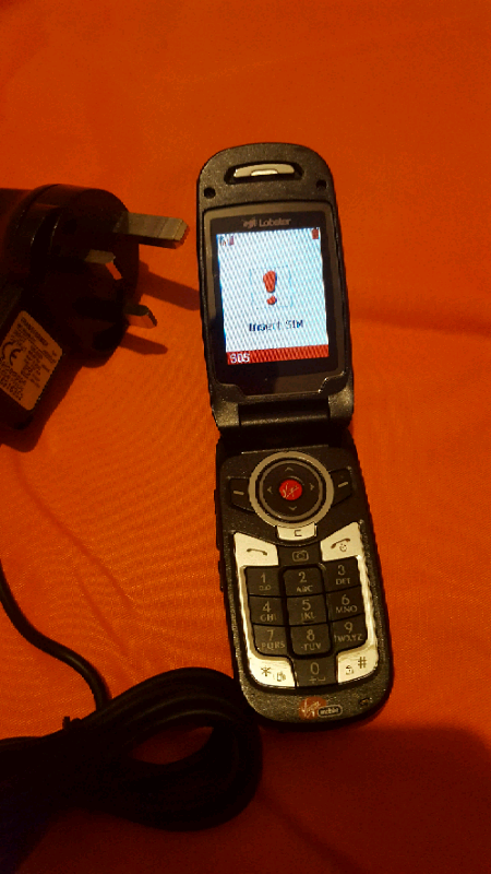 2 old phones with chargers. Both switch on.