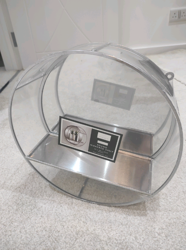 Round mirrored shelf