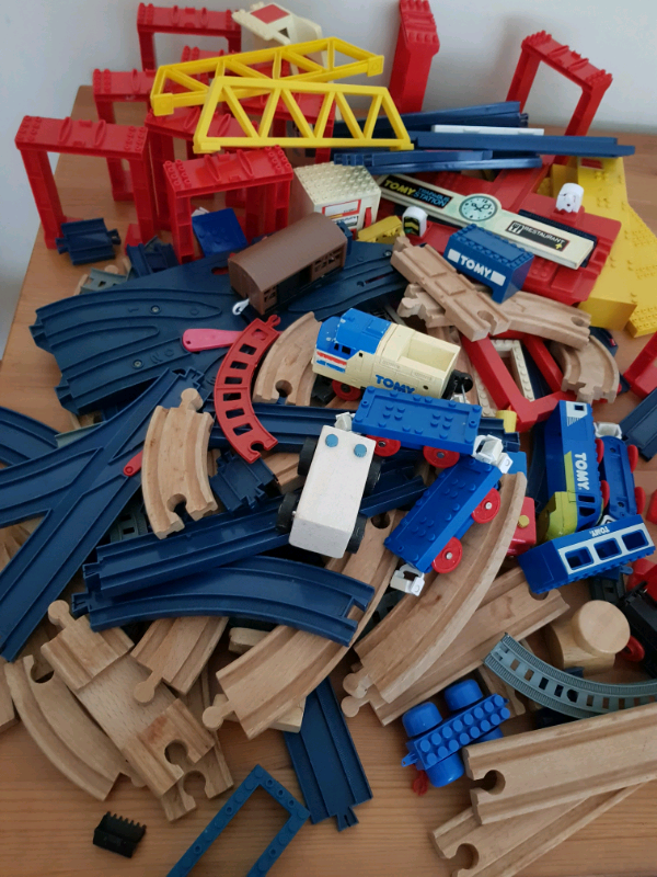 A bagful of railway tracks + locomotive, wagons, etc 