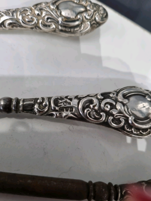 Silver collection of antique button hooks