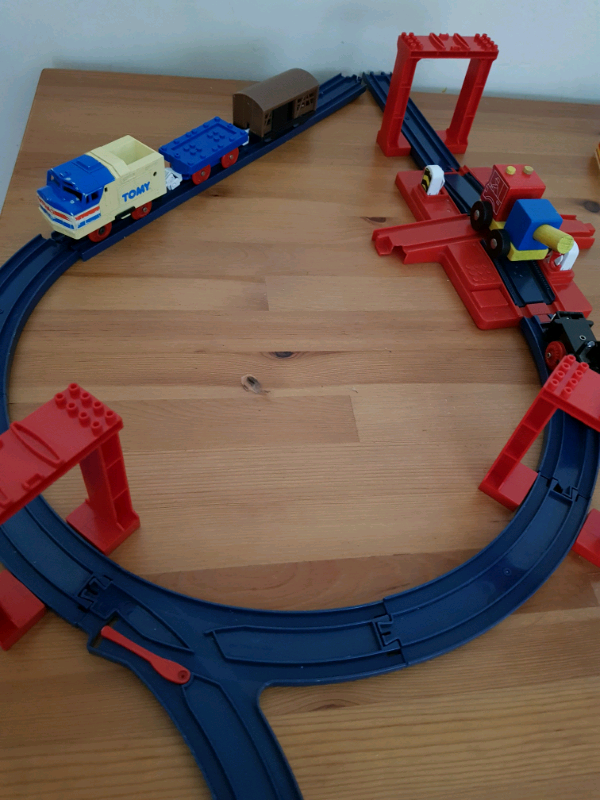 A bagful of railway tracks + locomotive, wagons, etc 