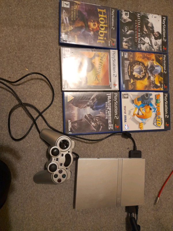 PlayStation 2 slimline with 6 games and controller