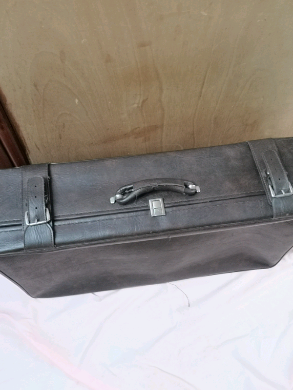 image for Medium size suitcase with wheels in excellent condition