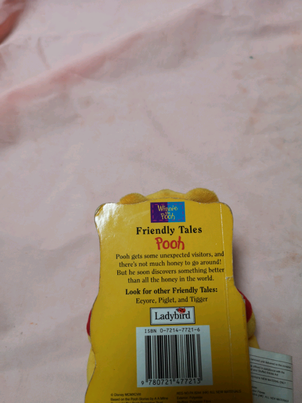 Winnie the pooh teddy with book (brand new).