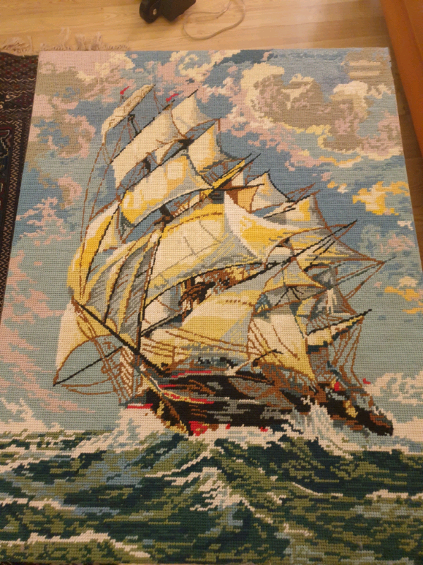 Ship on waves ,crossstitched picture 