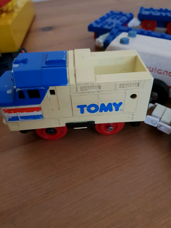 A bagful of railway tracks + locomotive, wagons, etc 