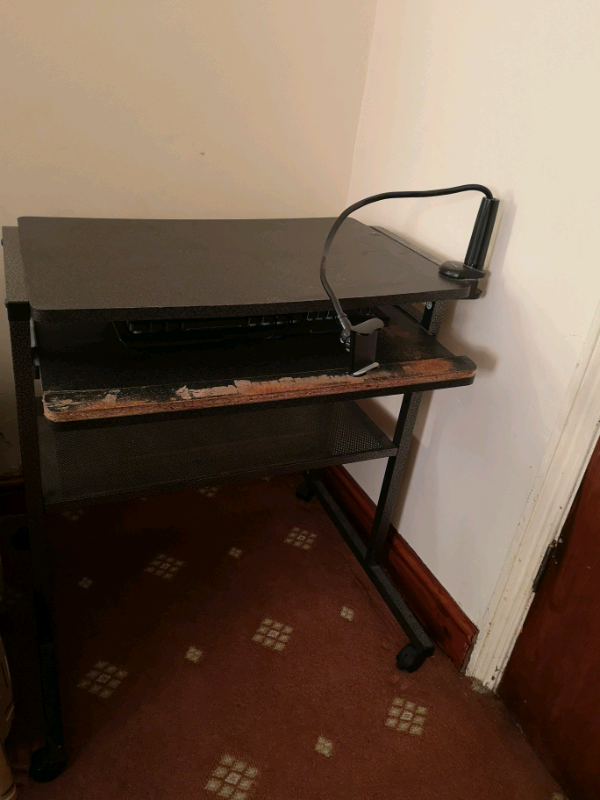 image for Pc table in black with pullout section for keyboard. 