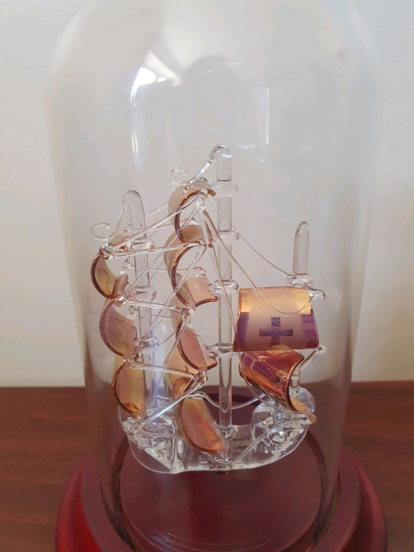 Glass ship in a bottle in ornament 