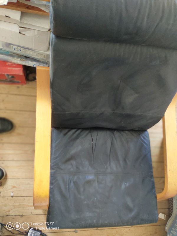 IKEA black armchair and footstool