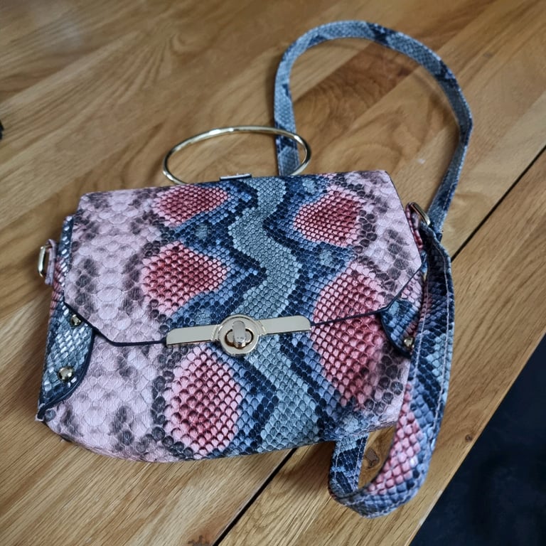 Brand new handbag.. Has gold bangle handle