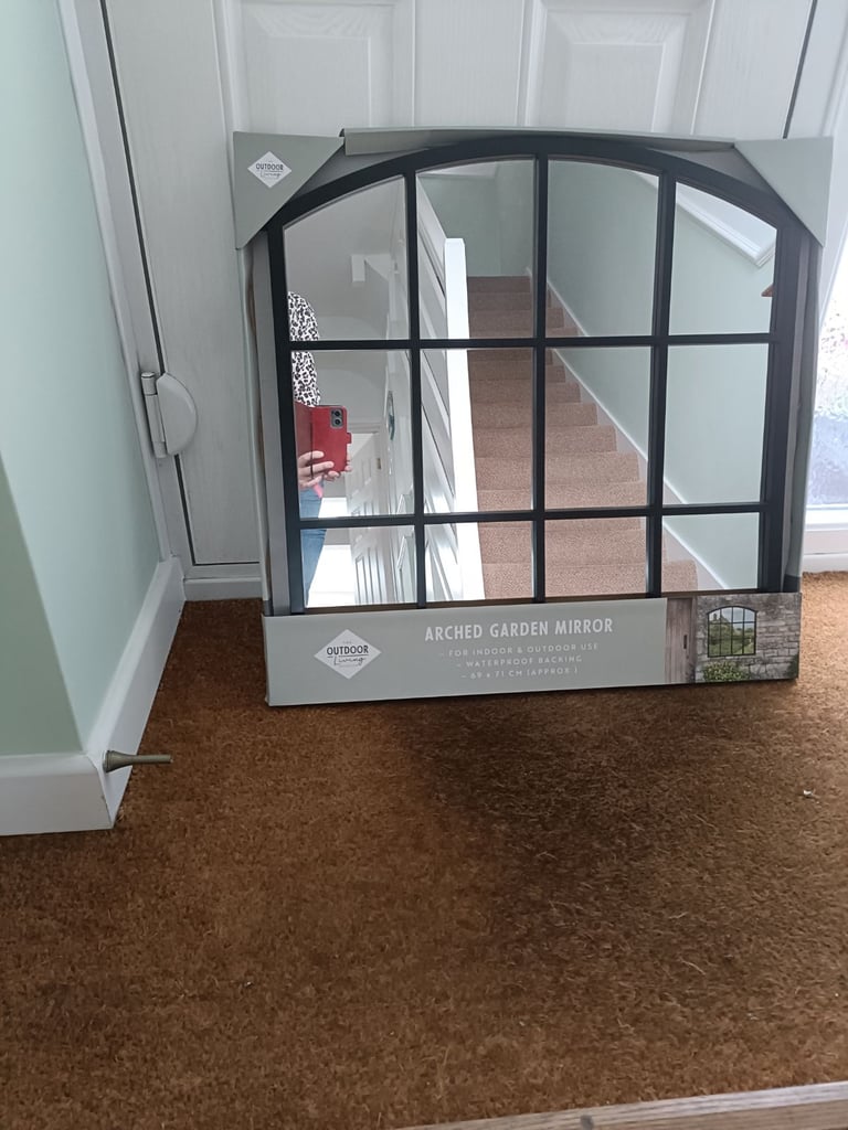Arched garden mirror
