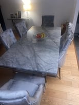 Grey marble table with 6 chairs with matching coffee table 