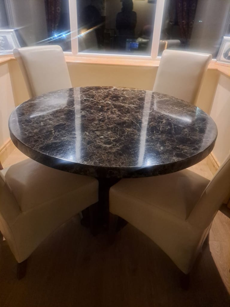 Composite marble table and 4 faux cream leather chairs