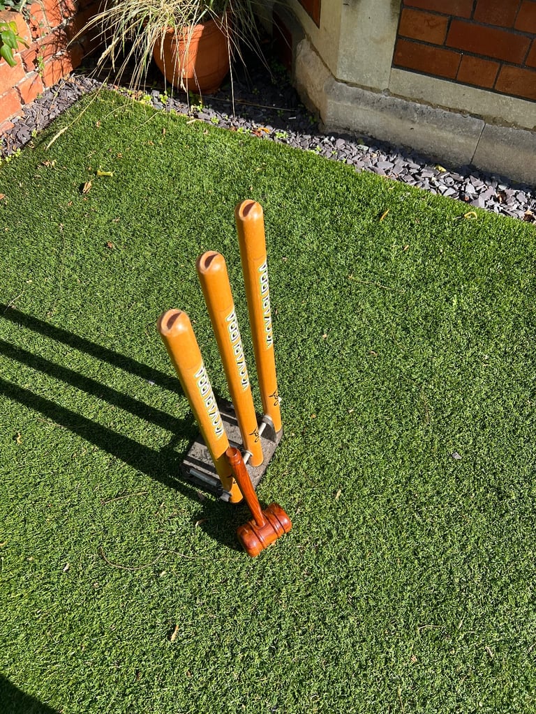 Spring back Kookaburra cricket stumps with cast iron base and a bat mallet