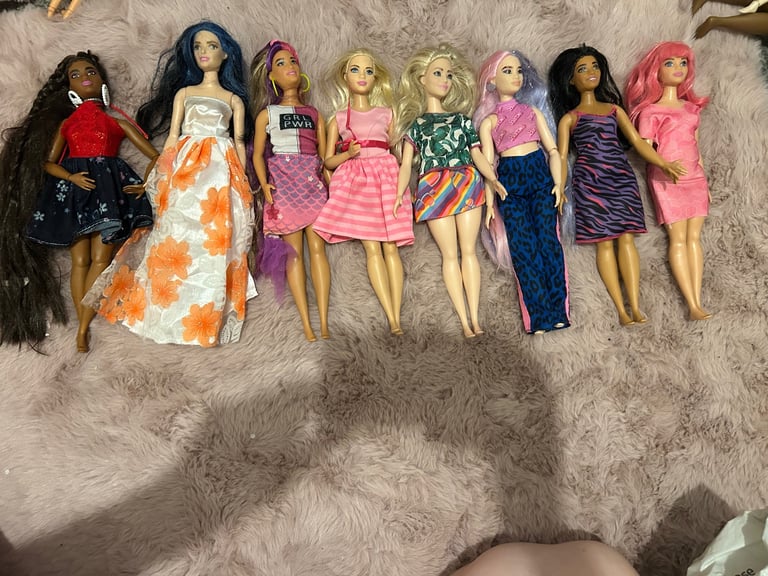 image for 9 curvy Barbie’s 