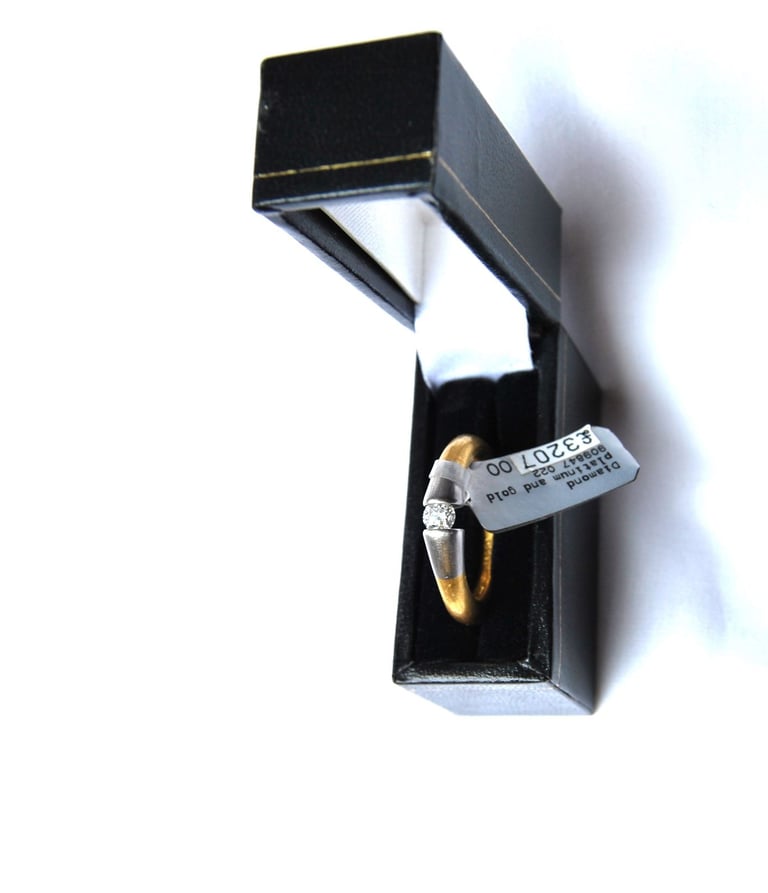 Diamond Solitaire Ring. Platinum and 22ct gold with 0.22 Brilliant Cut Solitaire Diamond