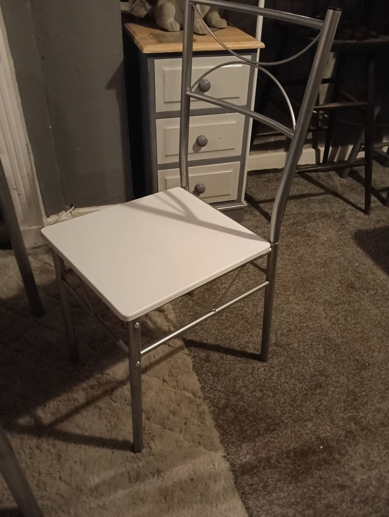 White dining table and four chairs feel free to contact me 