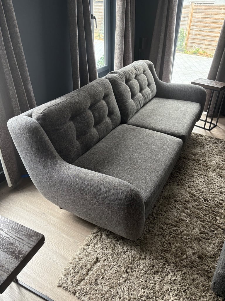 2 Four seater charcoal sofas and 2 foot stalls (DFS French connection) 