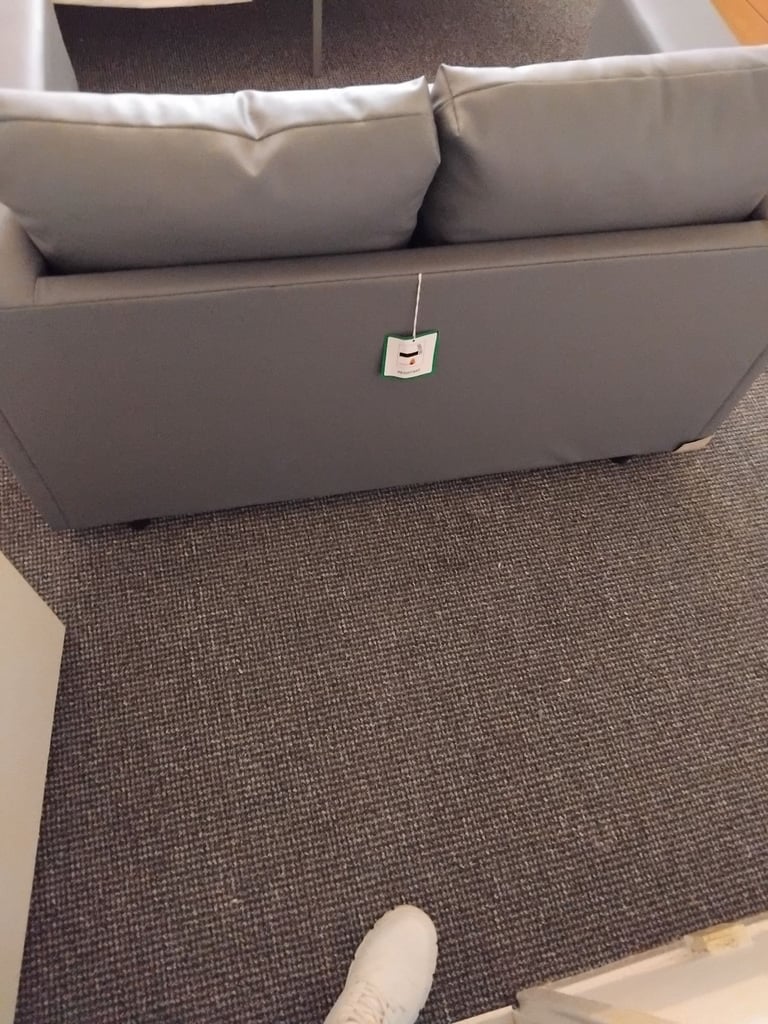 Brand new small 2 seater grey leather couch