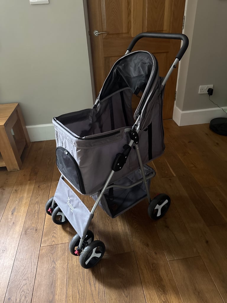 Like new dog buggy £25