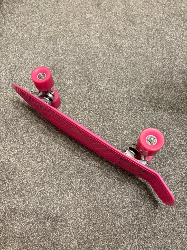 Pink plastic skateboard 