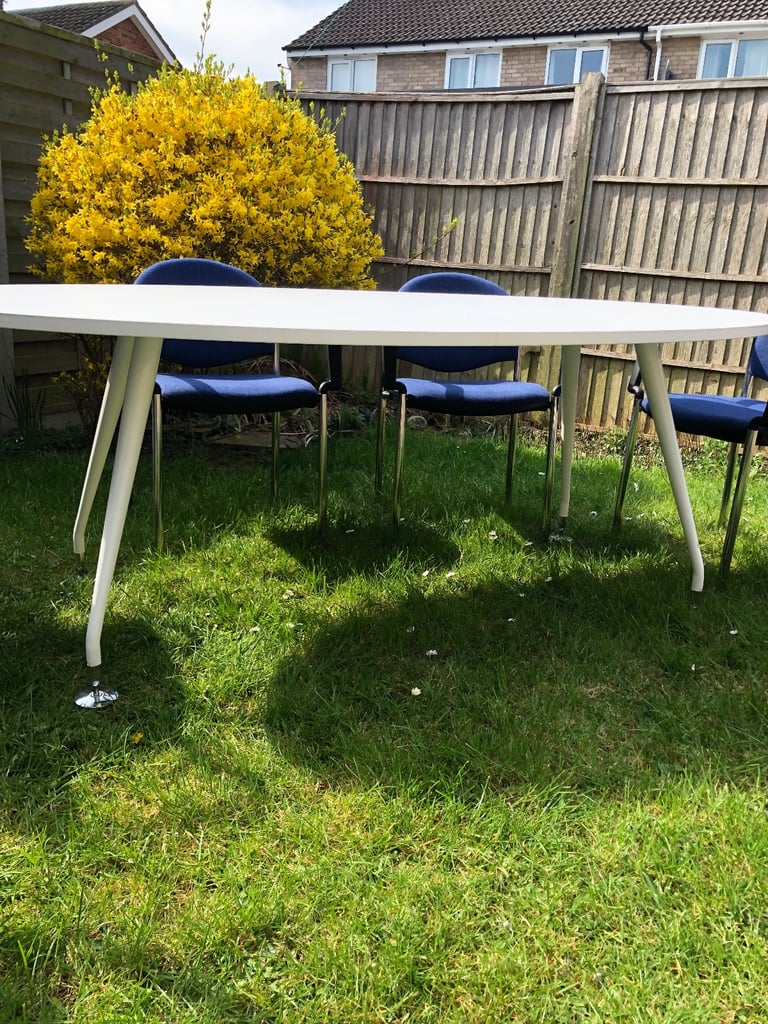 Conference table with 6 blue chairs 