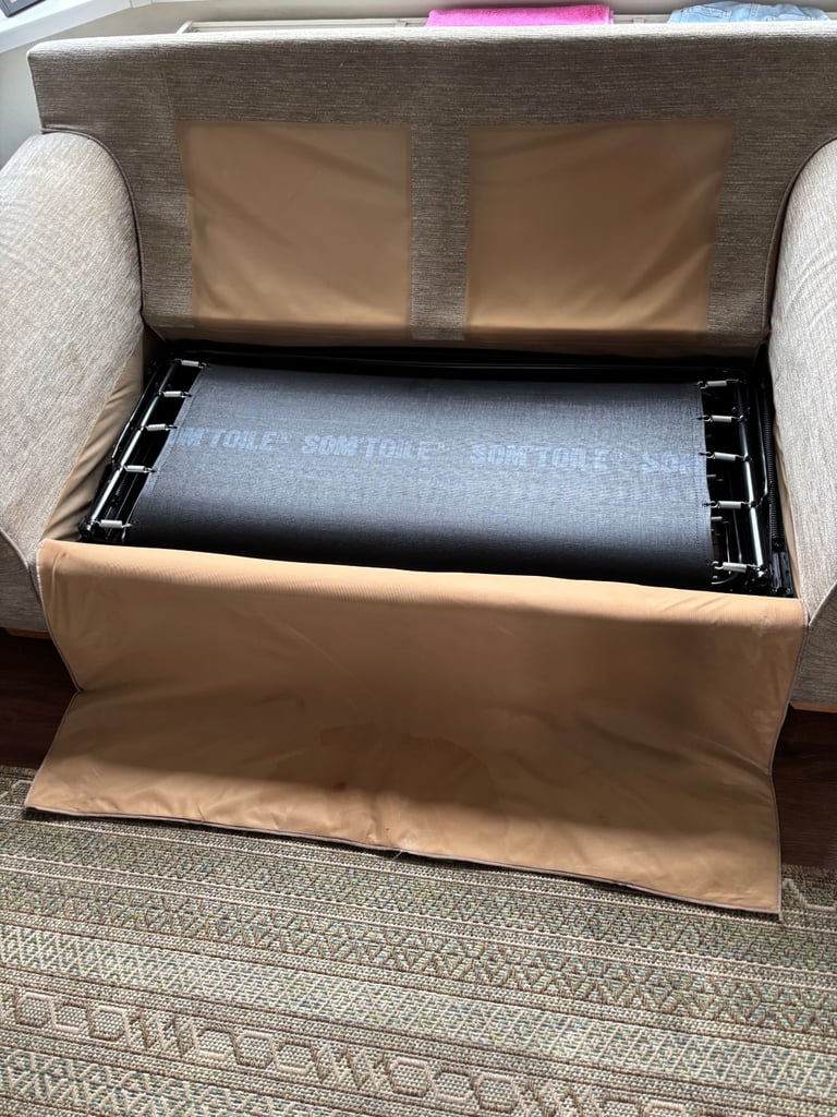 Beige sofa bed.