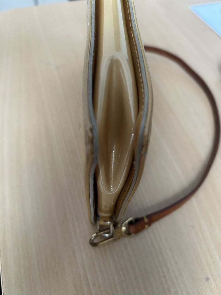 Louis Vuitton Beige Monogram Beige Remix Pochette Lexington handbag.