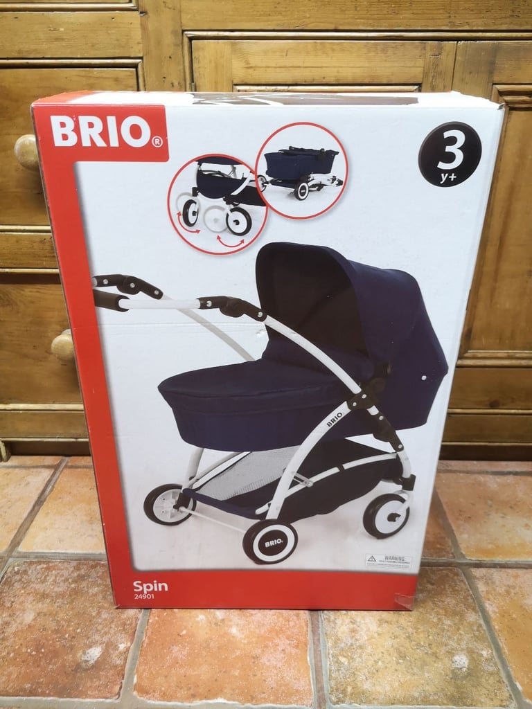 Brio Spin luxury toy pram for dolls & soft toys. Navy blue. Adjustable handle. Great used condition.