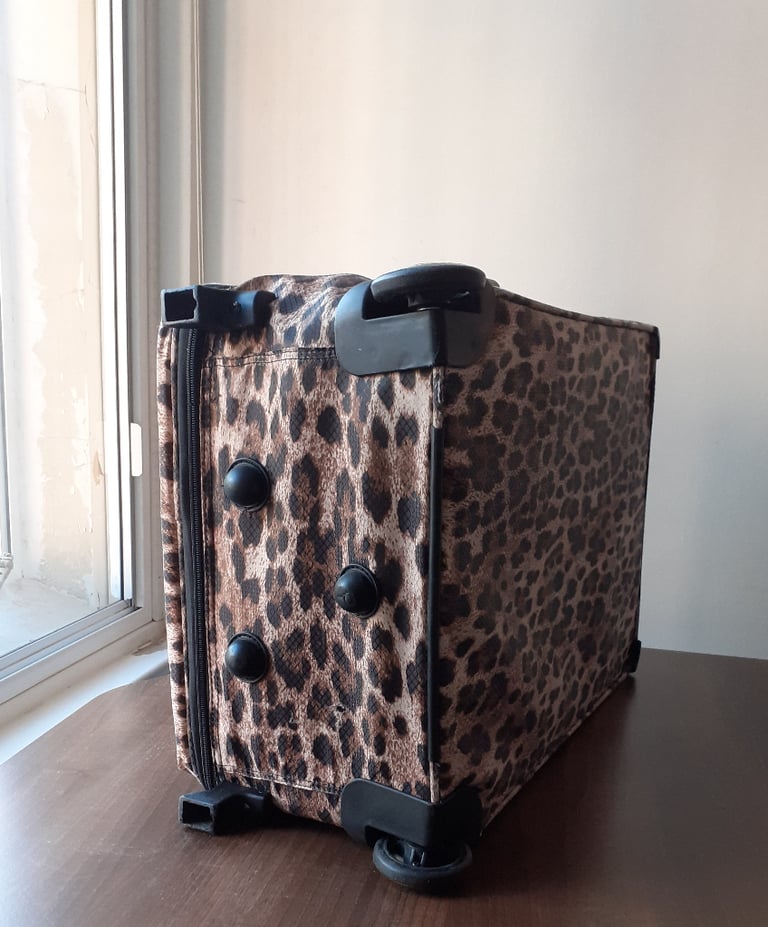 Matching pair of wheeled luggage in leopardskin print - stylish & functional
