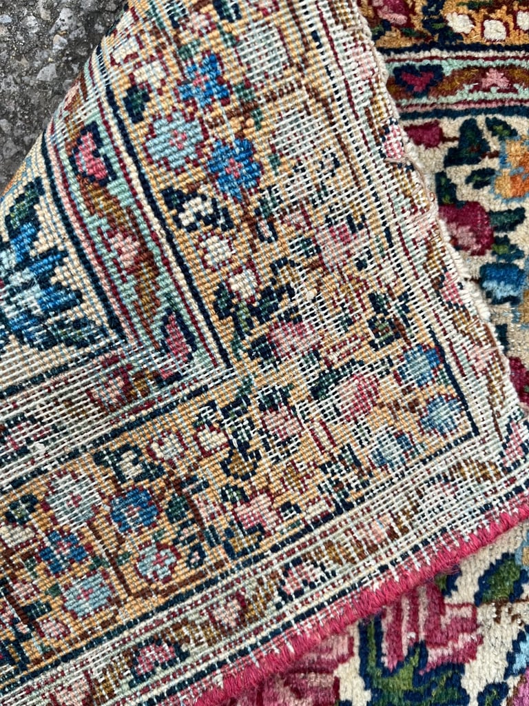 A pair of Antique Kirman mats 