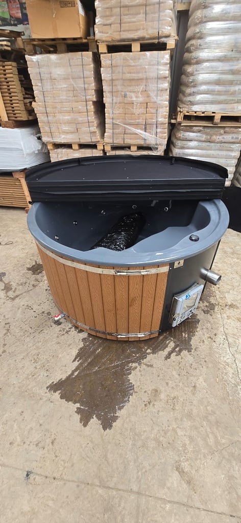 Wood fired hot tub with internal stove