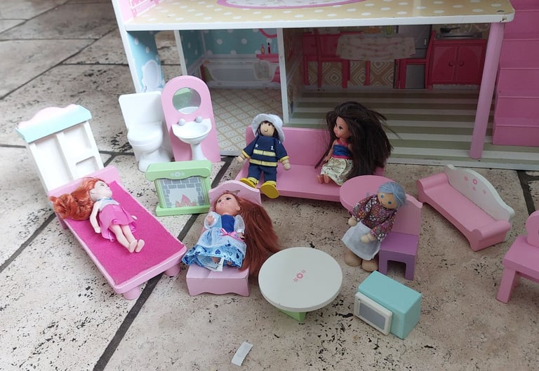 Wooden dolls house with furniture and dolls