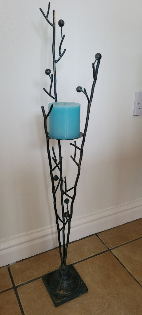 Metal iron decorative candlestick. Black with gold and blue