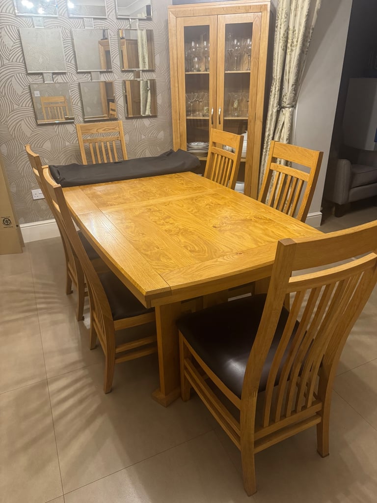 Extending Oak Dining Table with 8 matching chairs