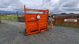 Ritchie cattle crush with weigh scales and front scoop tractor 