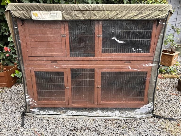 4ft “9 double guinea pig hutch with scratch and Newton rain cover. 