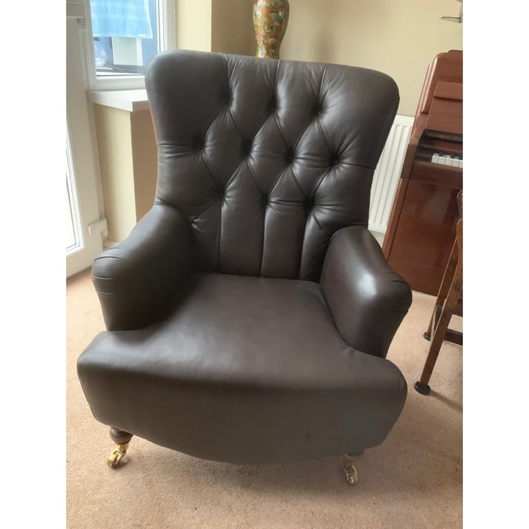 Superb brown leather club chair button back with castors 