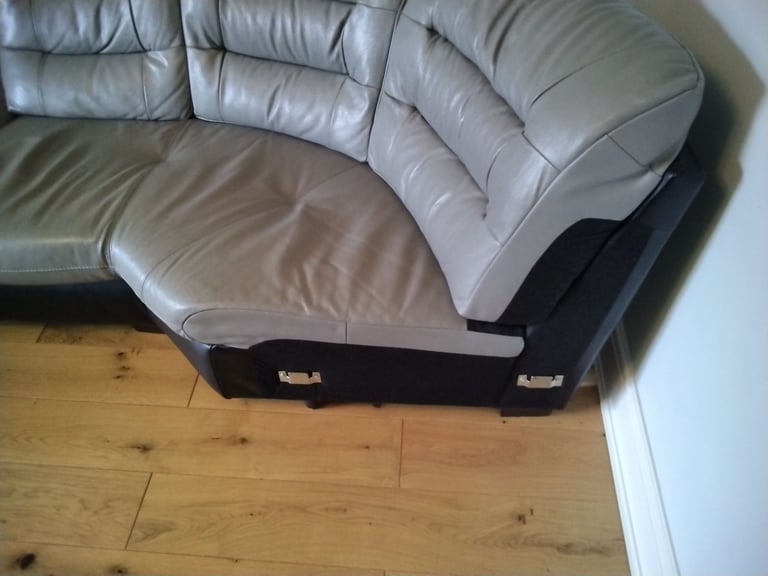 Black and grey leather corner unit.