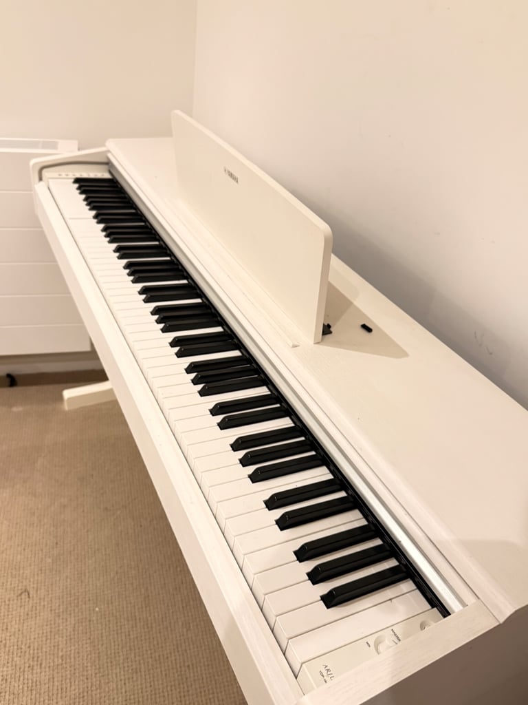 Yamaha white Piano in great condition ( like new) for £500
